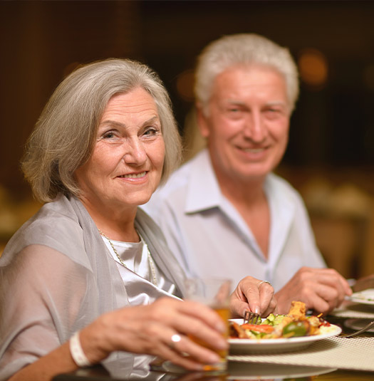 retirees at restaurant enjoying complimentary meal at a retirement seminar